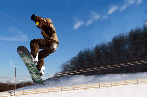 Skiers enjoying Bruce Mound winter slopes