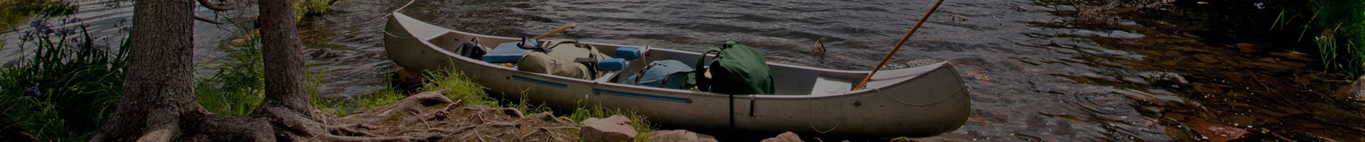 Canoe rests on scenic Lake Arbutus shoreline